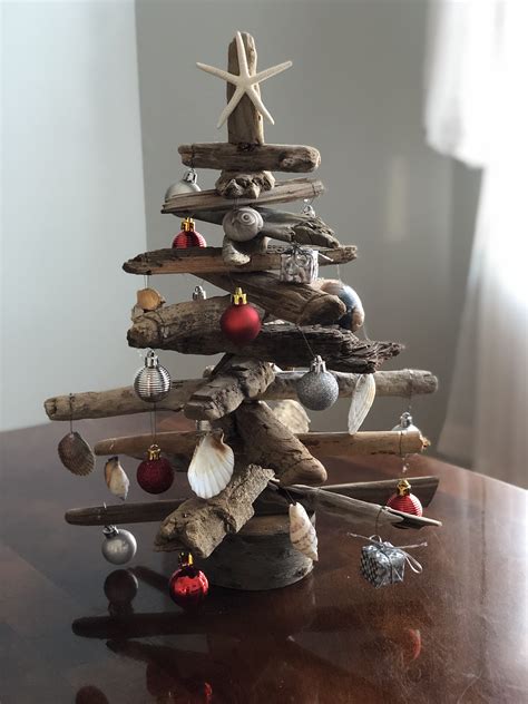 A Christmas tree decorated with seashells and driftwood