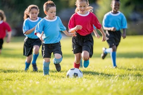 Kids Playing Soccer in a Park