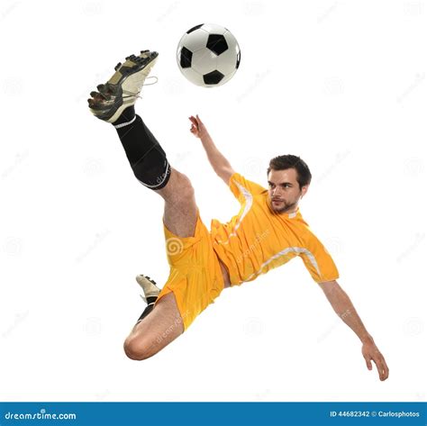 A Soccer Player Kicking the Ball in Mid-Air