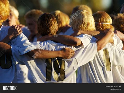 A Soccer Team in a Huddle Before a Match