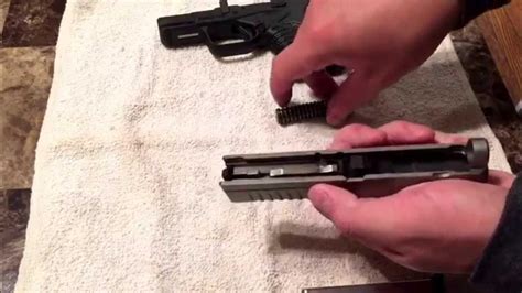 Disassembled Springfield XDS 9mm pistol with components