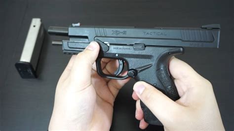 Field-stripped Springfield XDS 9mm pistol with components