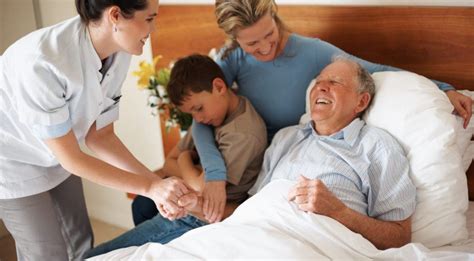 Healthcare professionals providing emotional support to patients and families in palliative care settings