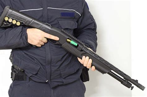 A tactical shotgun with a pistol grip