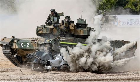 A tank vehicle navigating difficult terrain