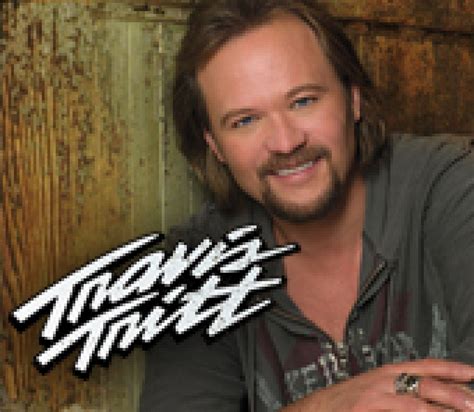 Travis Tritt performing on stage