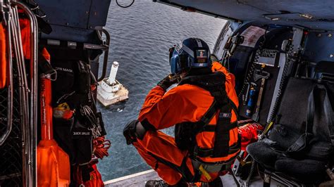 US Coast Guard Recruiters Maintaining Equipment