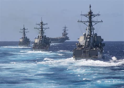 A US Navy Strike Group conducting a maritime interdiction operation