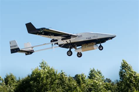 Unmanned Aerial Vehicle Flying Over an Aircraft Carrier