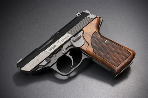 Walther P5 pistol being held by a shooter