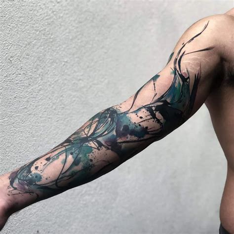 Abstract arm sleeve tattoos with geometric shapes