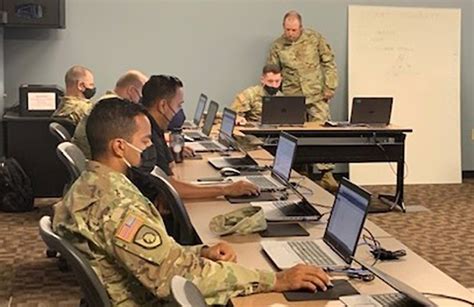 Soldier in uniform working at a desk