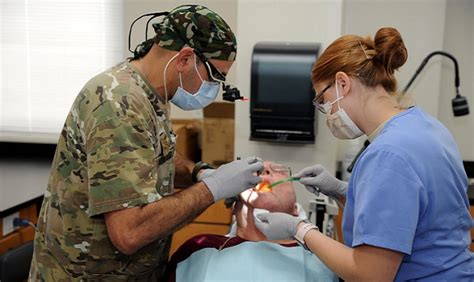 Air Force dental assistant in a clinic