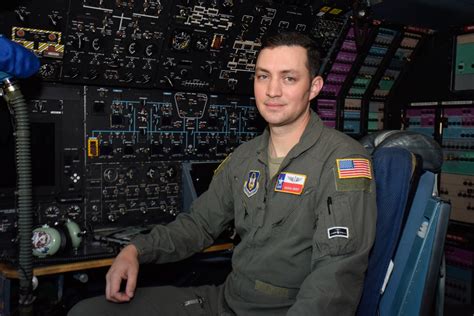 Air Force Flight Engineer Inspecting Aircraft