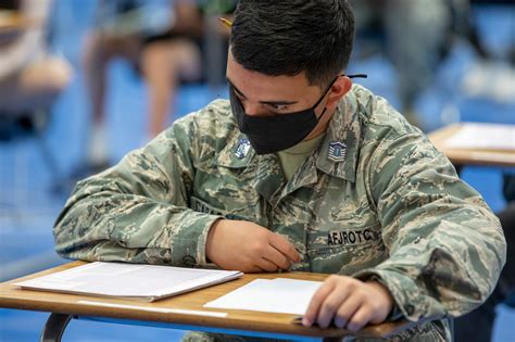 Air Force Recruiter Administering ASVAB Test