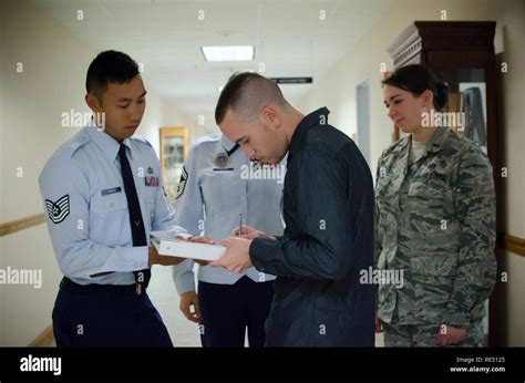 Air Force Recruiter Processing Enlistment Paperwork