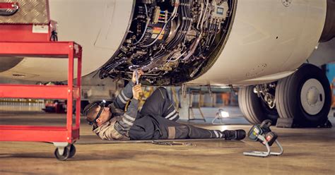 Aircraft mechanic performing routine maintenance