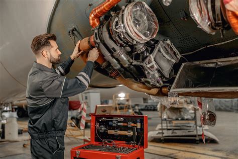 Aircraft mechanic performing repairs