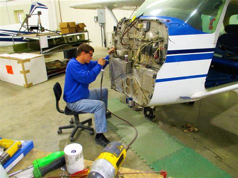 Aircraft mechanic troubleshooting an electrical issue