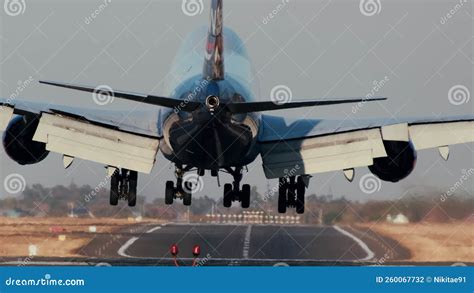 Airplane touching down on the runway