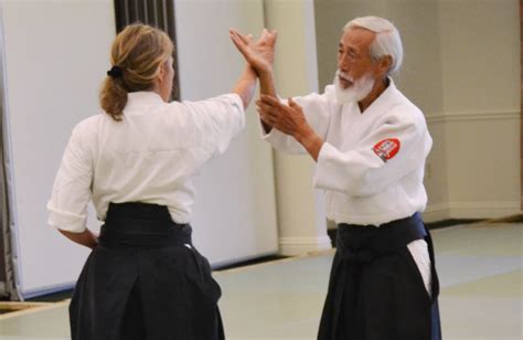 Image of an akido master teaching students