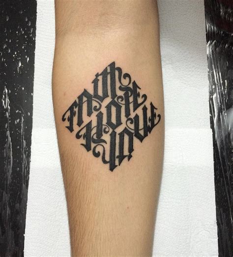 Ambigram tattoo artists at work