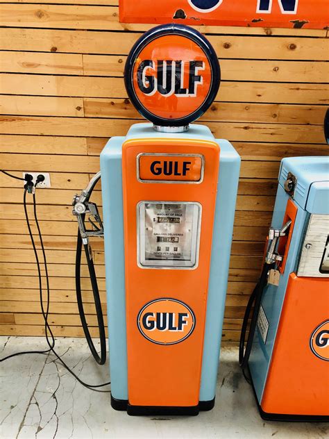 An antique gas pump with a beautifully restored finish