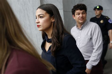 AOC speaking at a press conference