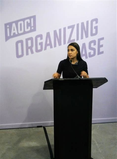 AOC speaking to a group of organizers