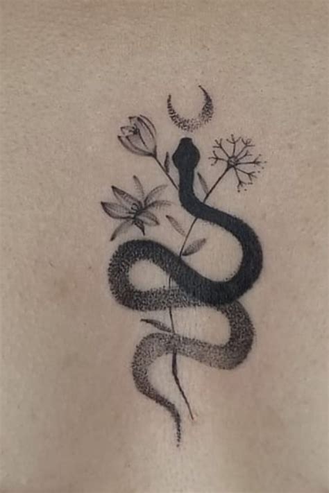 Applying snake tattoos