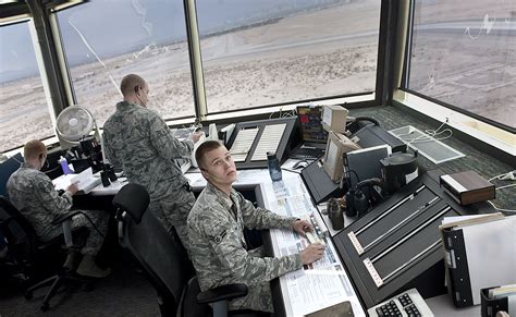 Army air traffic control specialist communicating with a pilot