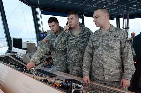 Army air traffic control specialists working in a control tower