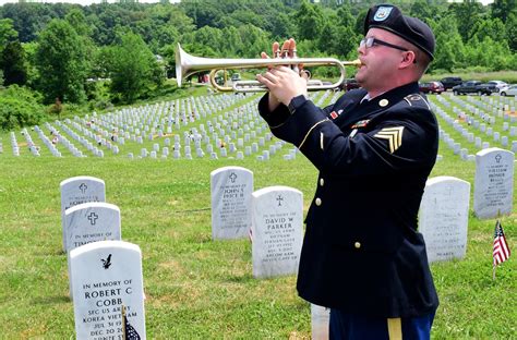 A U.S. Army bugler playing a call