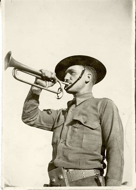 A U.S. Army bugler playing a call