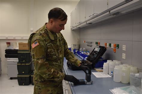 Army environmental engineers working in a lab