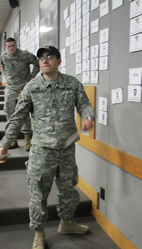 A photo of a soldier on their first duty assignment, working and interacting with colleagues