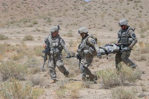 Army medic evacuating a wounded soldier