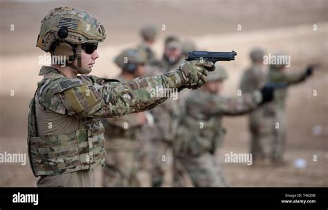 Army medic with M9 pistol