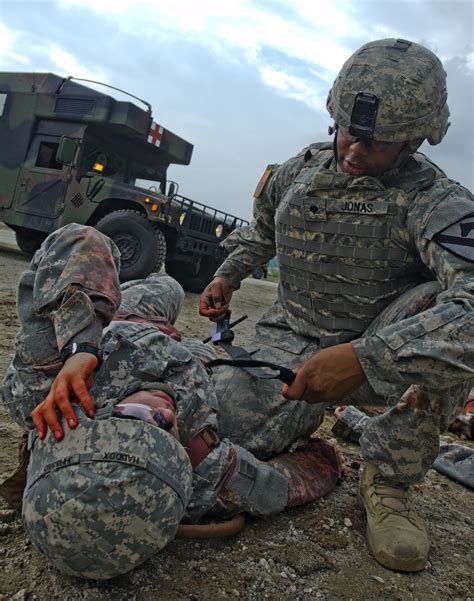 Medics treating a wounded soldier