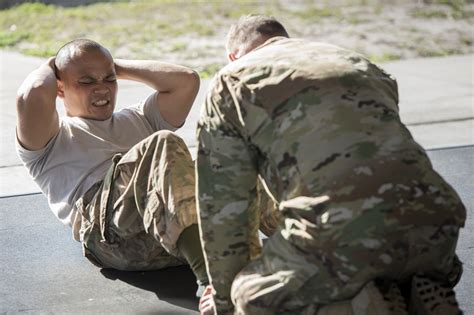 Soldiers performing sit-ups during the APFT