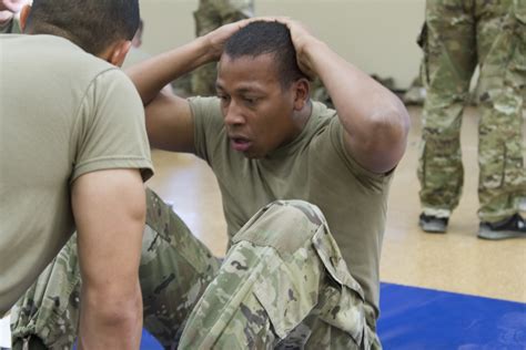 Soldiers performing sit-ups during the APFT