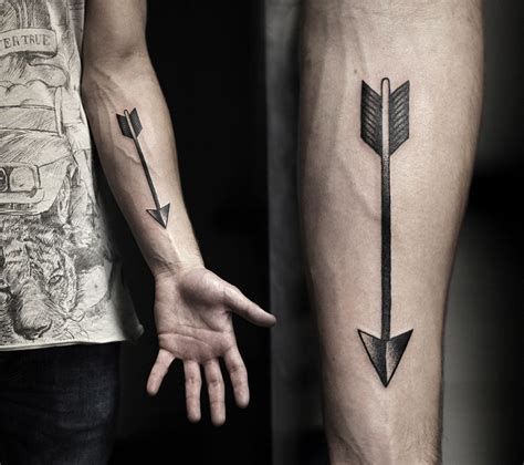 Arrow back forearm tattoo