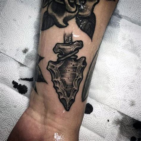 Arrowhead tattoo symbolism