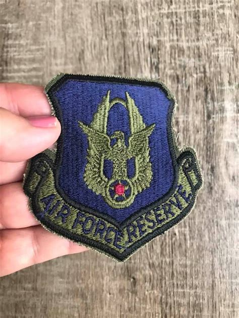 Authentic Air Force Reserve patches on a collector's shelf