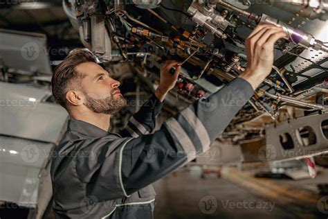 Aviation Mechanic Inspecting Components