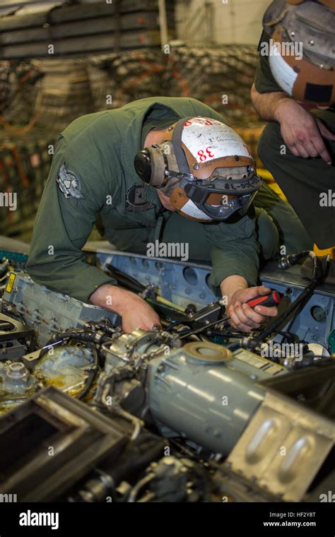 Aviation Mechanic in the Marine Corps performing a structural repair