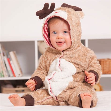 Newborn baby wearing a reindeer onesie