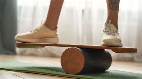 Senior practicing balance boards