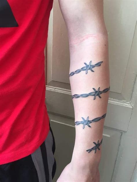 Inspiration for barbwire arm tattoos