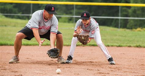 Coach using baseball diamond diagram to explain strategy